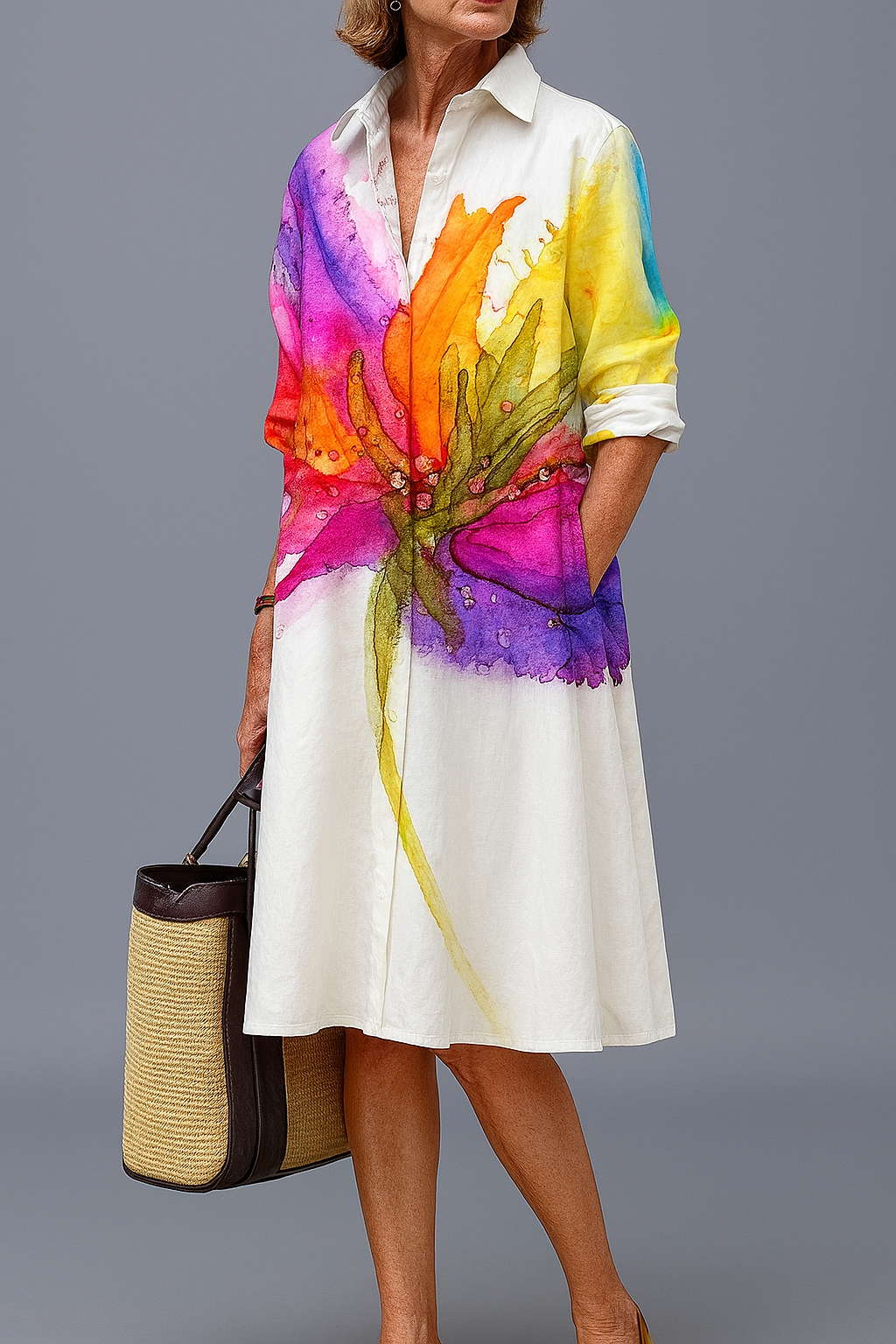 Front view of a model wearing the vibrant floral midi dress, showcasing its colorful pattern and elegant flowy silhouette against a bright outdoor background.