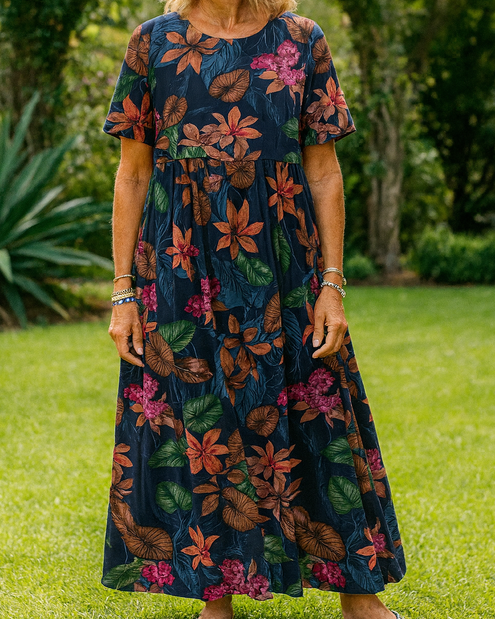 Side profile of the Eliza comfortable floral maxi dress, highlighting its flattering drape and short sleeves.
