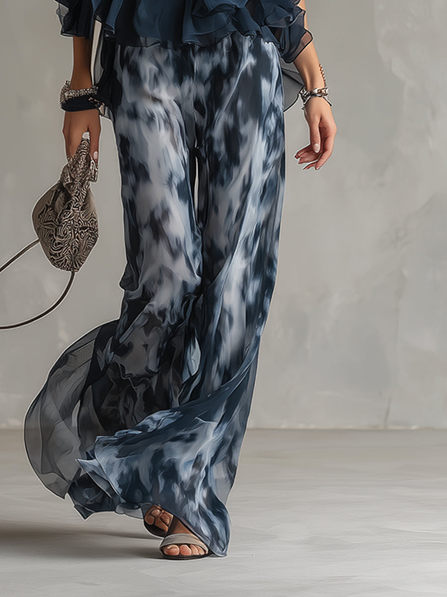 Detail image focusing on the texture of the chiffon fabric and the subtle pattern of the elegant set.
