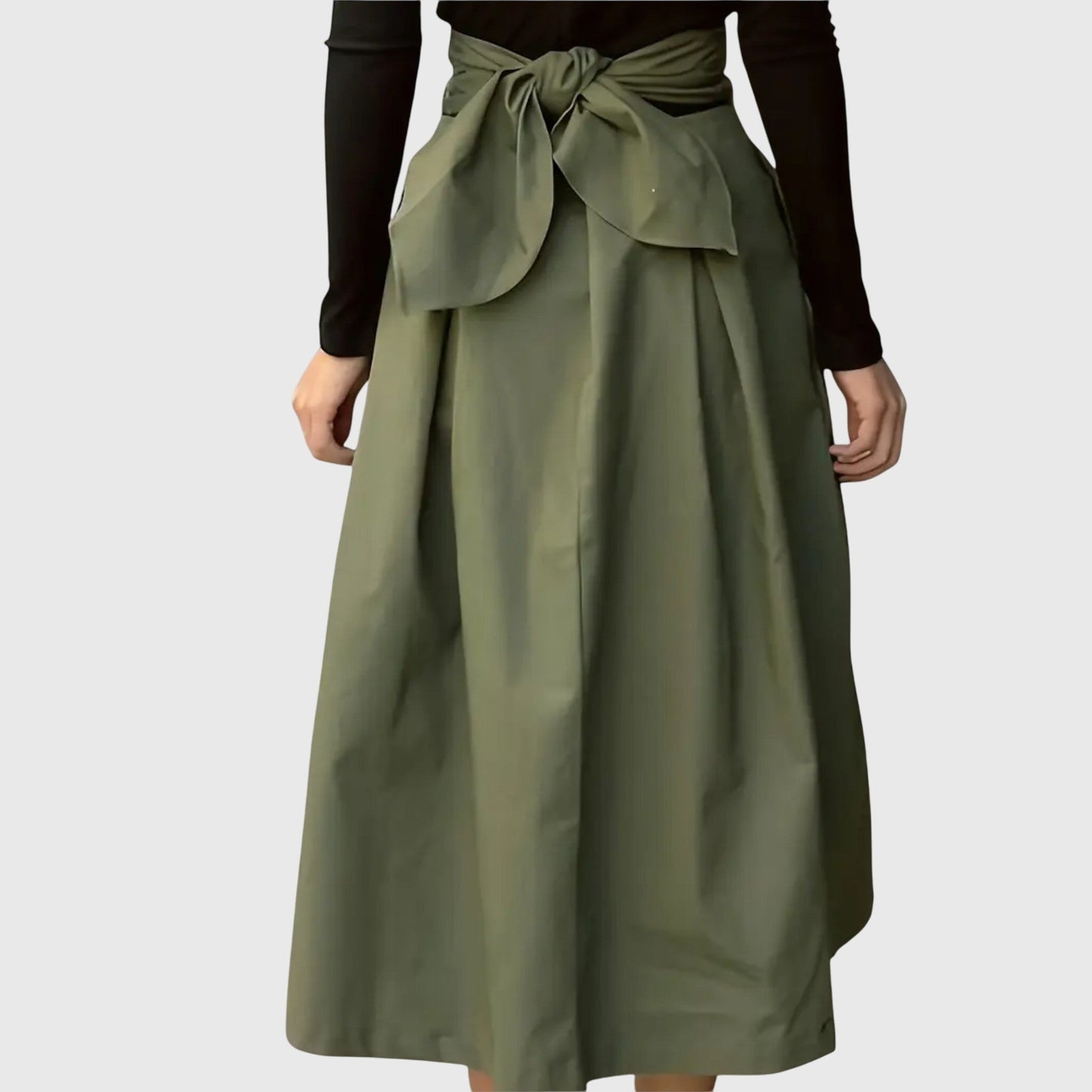 Lifestyle shot of the Jade flowy midi skirt paired with a casual top, perfect for a relaxed yet stylish look.