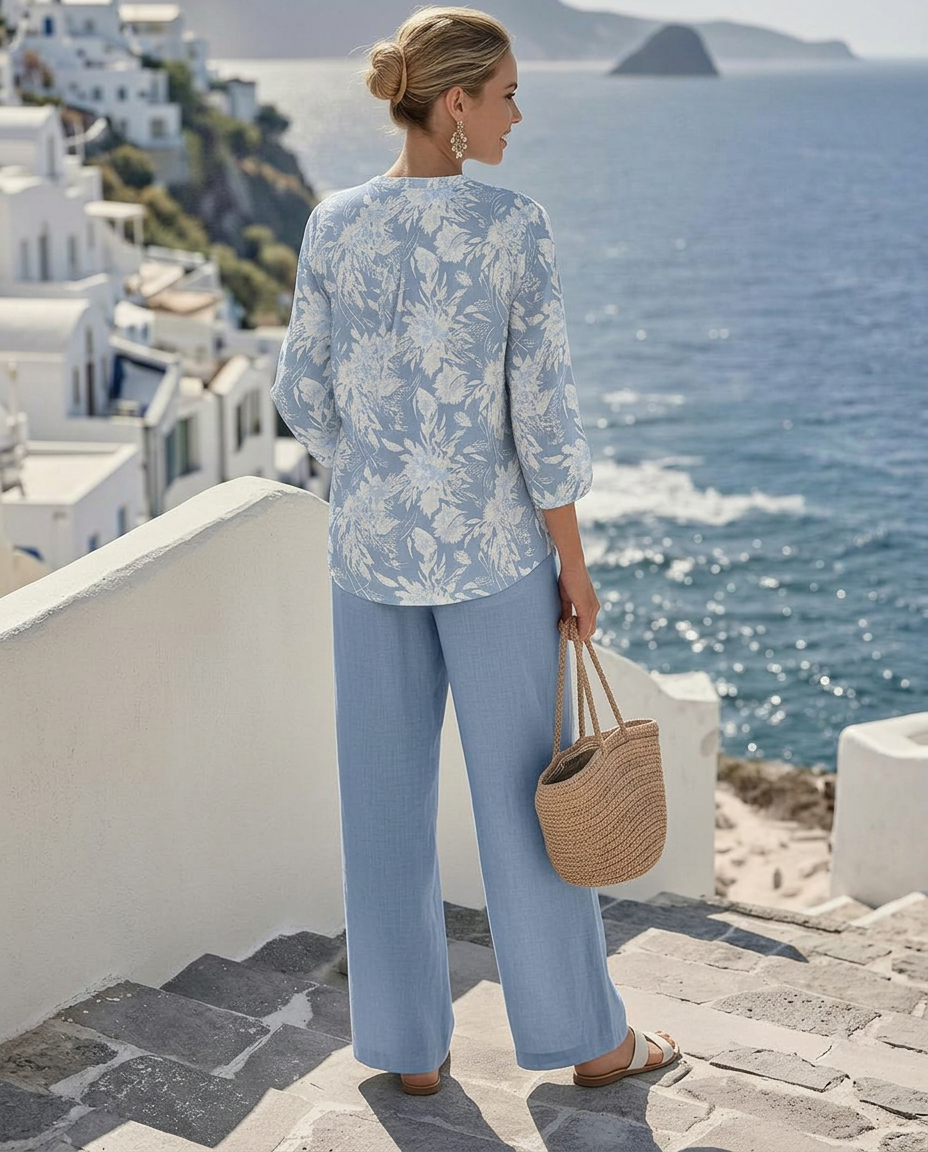Close-up detail of the vibrant floral print on the Adira blouse fabric, highlighting texture and colors.
