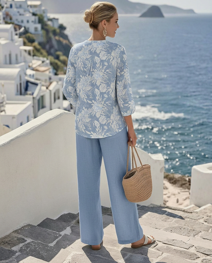 Close-up detail of the vibrant floral print on the Adira blouse fabric, highlighting texture and colors.