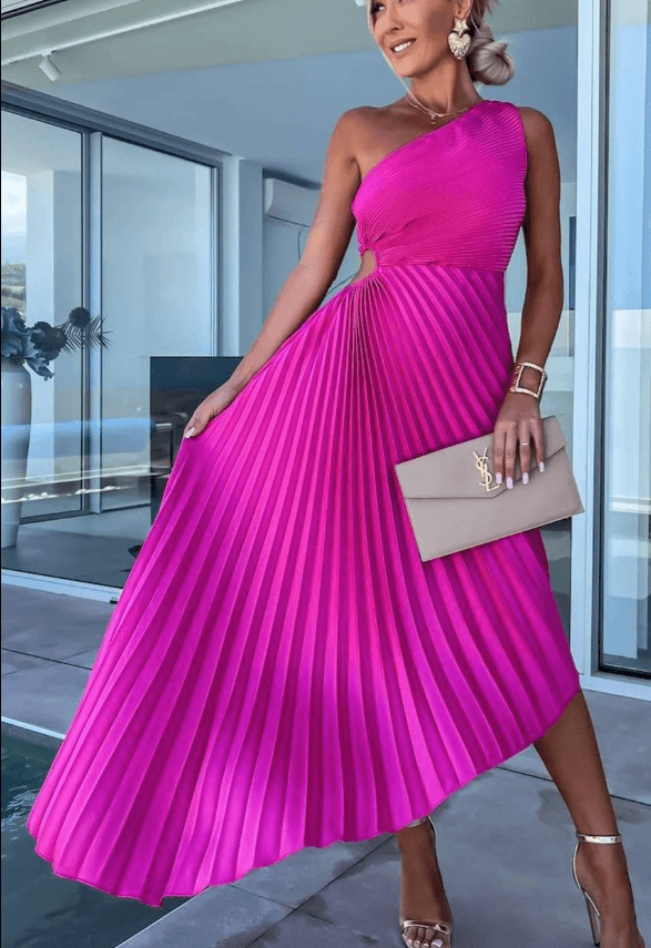 Close-up detail of the polished metal ring at the waist of the elegant pleated midi dress, with gathered fabric.