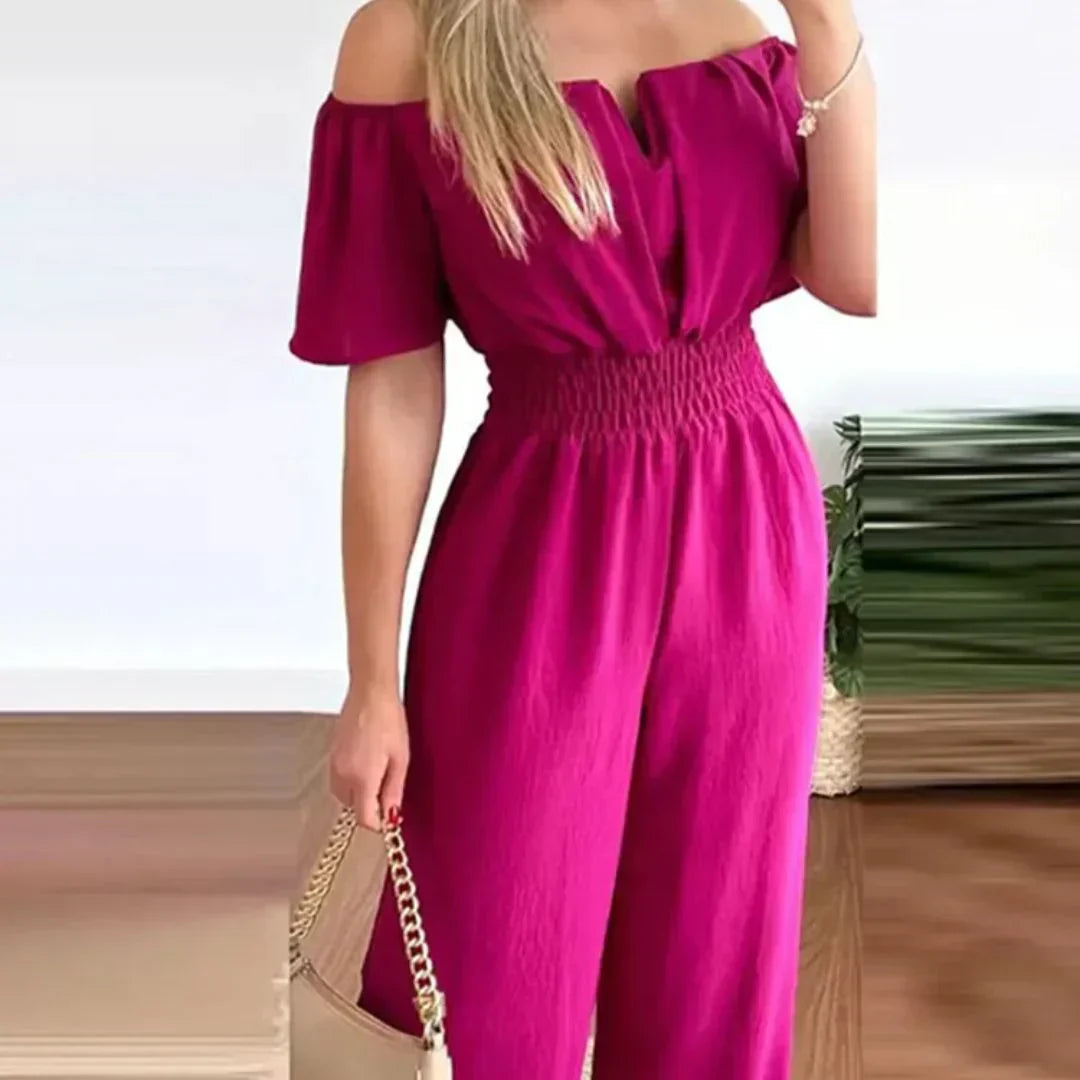 Close-up detail of the elastic waistband and off-shoulder neckline on the stylish jumpsuit.