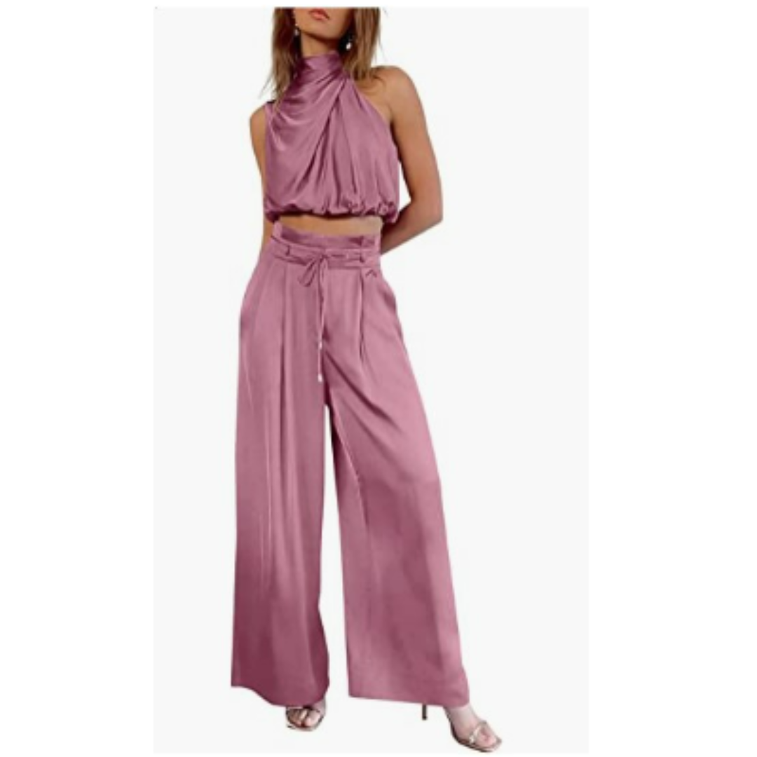 Woman posing playfully in a pink Seraphina jumpsuit, emphasizing its versatility for various activities.