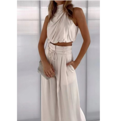 Stylized image of a woman confidently walking in a green Seraphina jumpsuit, showing movement and comfort.