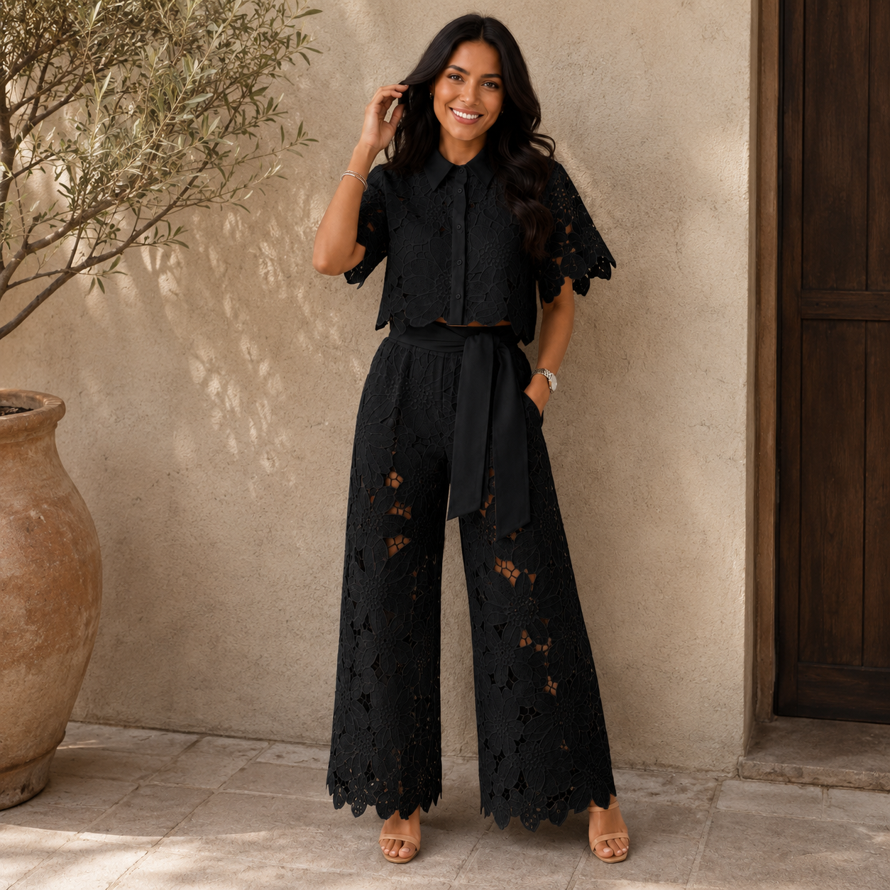 Front view of a woman wearing a white Aria comfortable two-piece set, showcasing the cropped top and wide-leg pants.