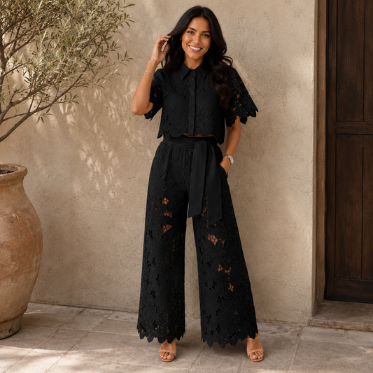 Front view of a woman wearing a white Aria comfortable two-piece set, showcasing the cropped top and wide-leg pants.