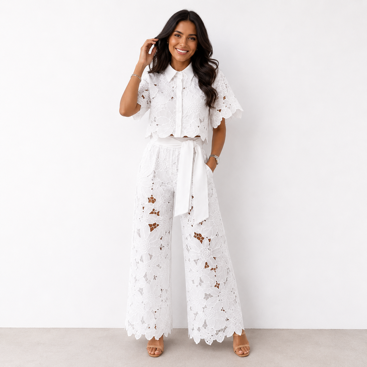 Close-up detail of the intricate floral cut-out pattern on the fabric of the stylish two-piece set.