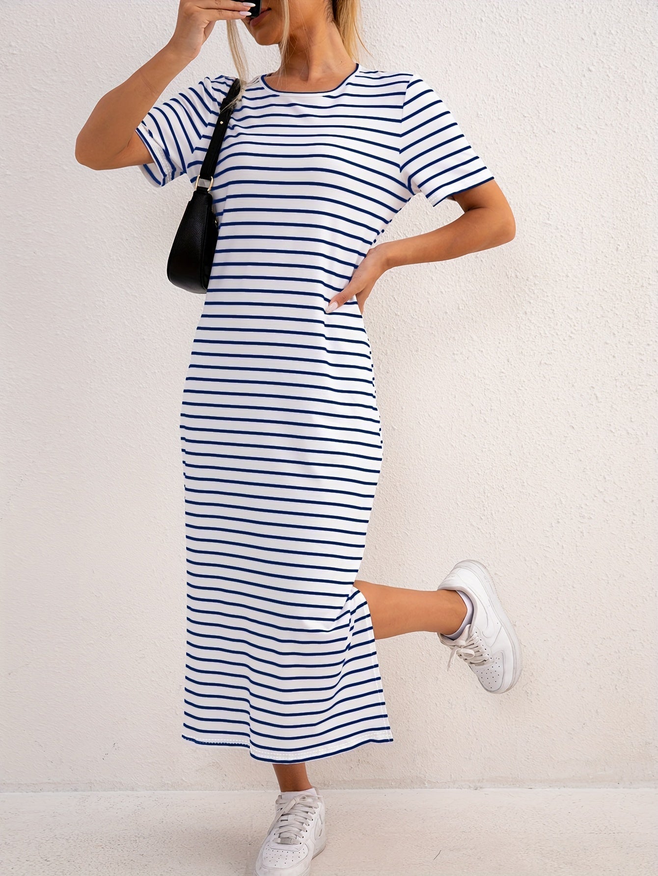 Close-up detail of the soft ribbed fabric and classic stripe pattern on the comfortable jersey midi dress.
