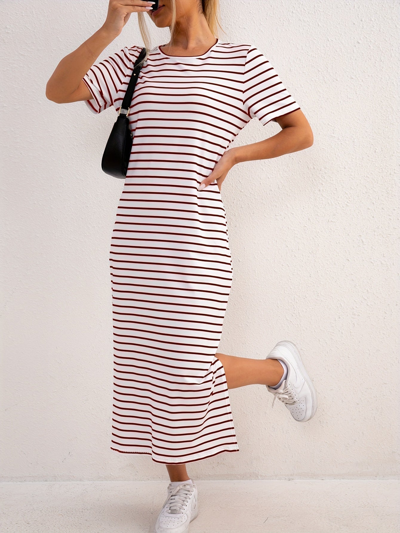 Back view of the versatile striped jersey midi dress, highlighting its smooth fit and comfortable drape.