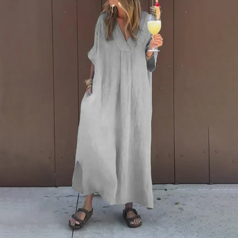 Flat lay of the Aurora casual V-neck dress in yellow, demonstrating the soft cotton-linen material and cut.