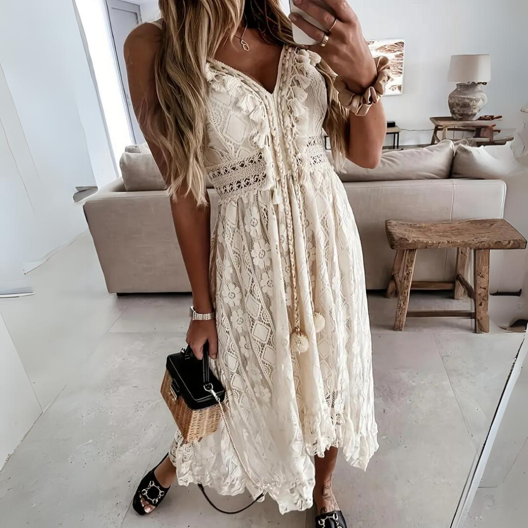 Front view of the Bianca boho lace midi dress in a soft beige color, showcasing the V-neck and tie details.
