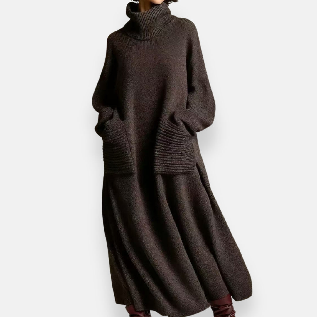 Front view of a woman wearing the Bianca cozy knit high-neck dress in coffee, standing elegantly.