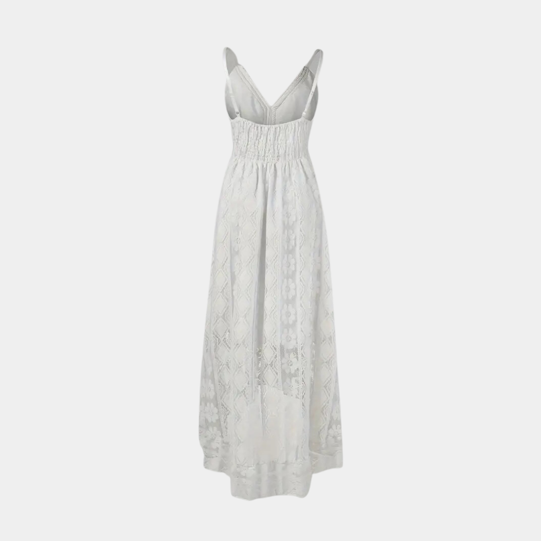 A woman twirling in the beige Bianca boho lace midi dress, emphasizing its flowy and airy design.