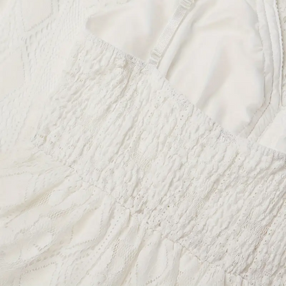 An overhead flat lay of the Bianca boho lace midi dress, displaying its intricate lace patterns and soft fabric.