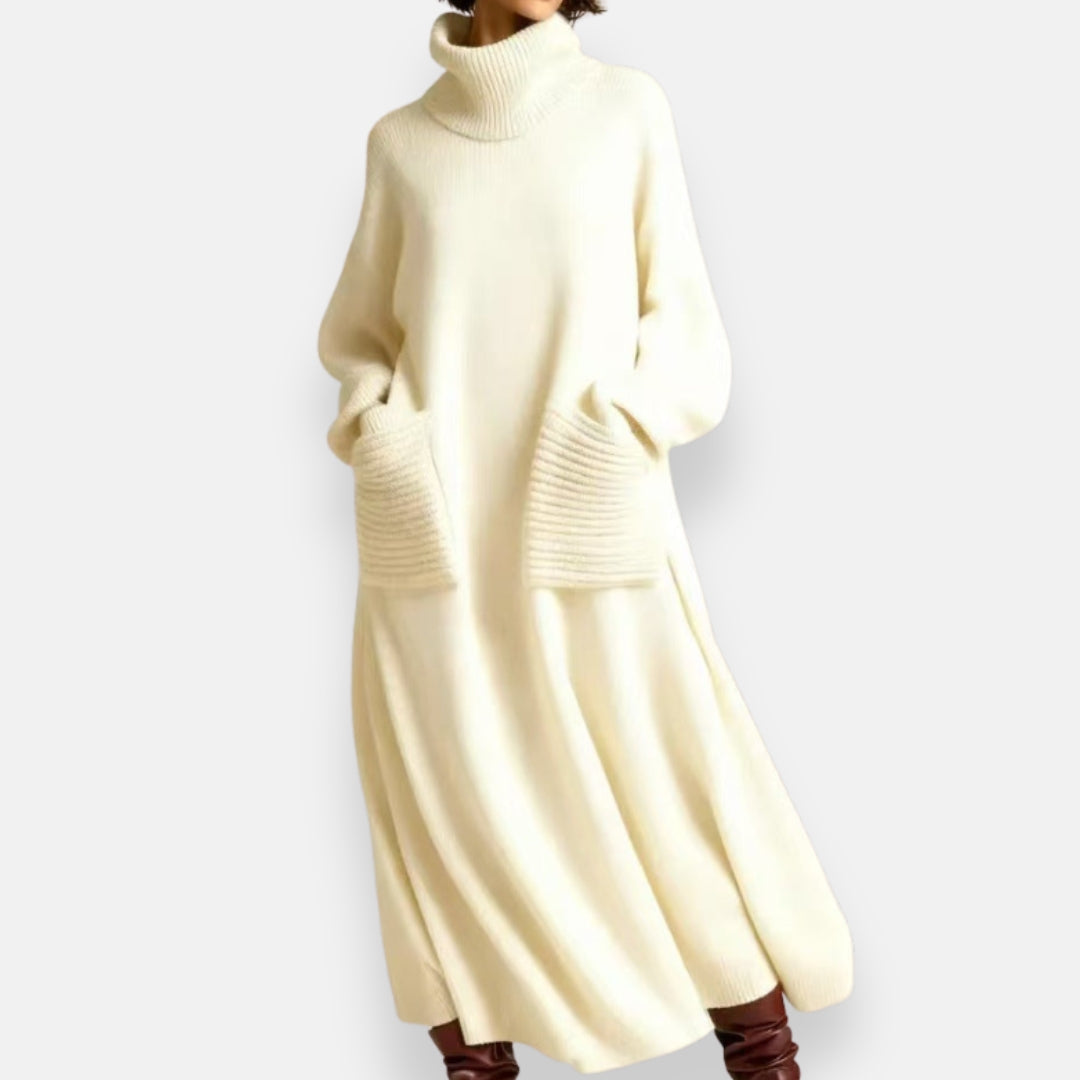 Side profile of a woman showcasing the flowy silhouette of the Bianca cozy knit high-neck dress.