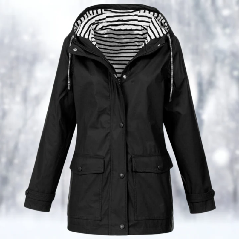 Close-up detail of the durable zipper and protective storm flap on the front of the Lyra stylish rain jacket.
