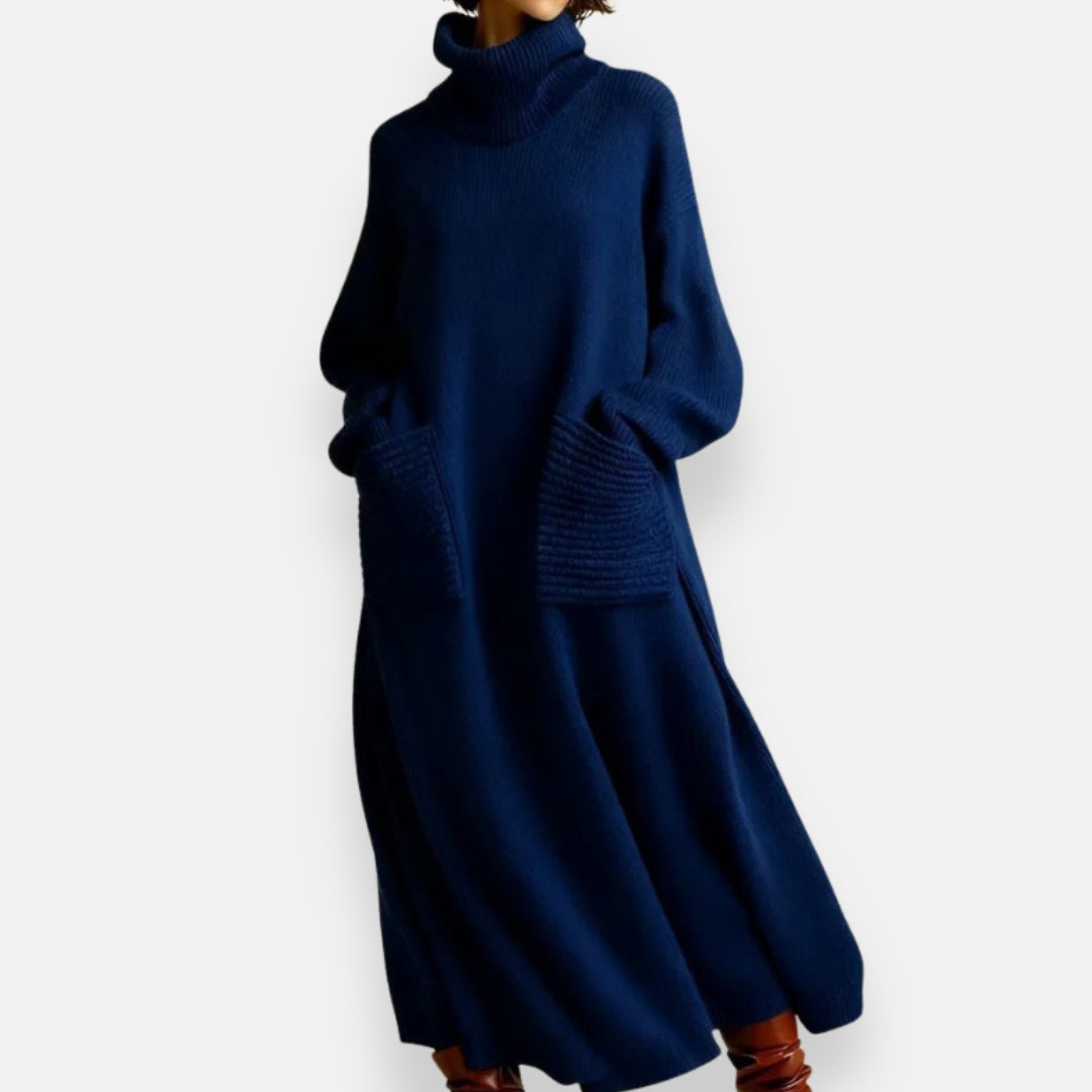 Woman casually posing in the Bianca cozy knit high-neck dress, highlighting its spacious fit and pockets.