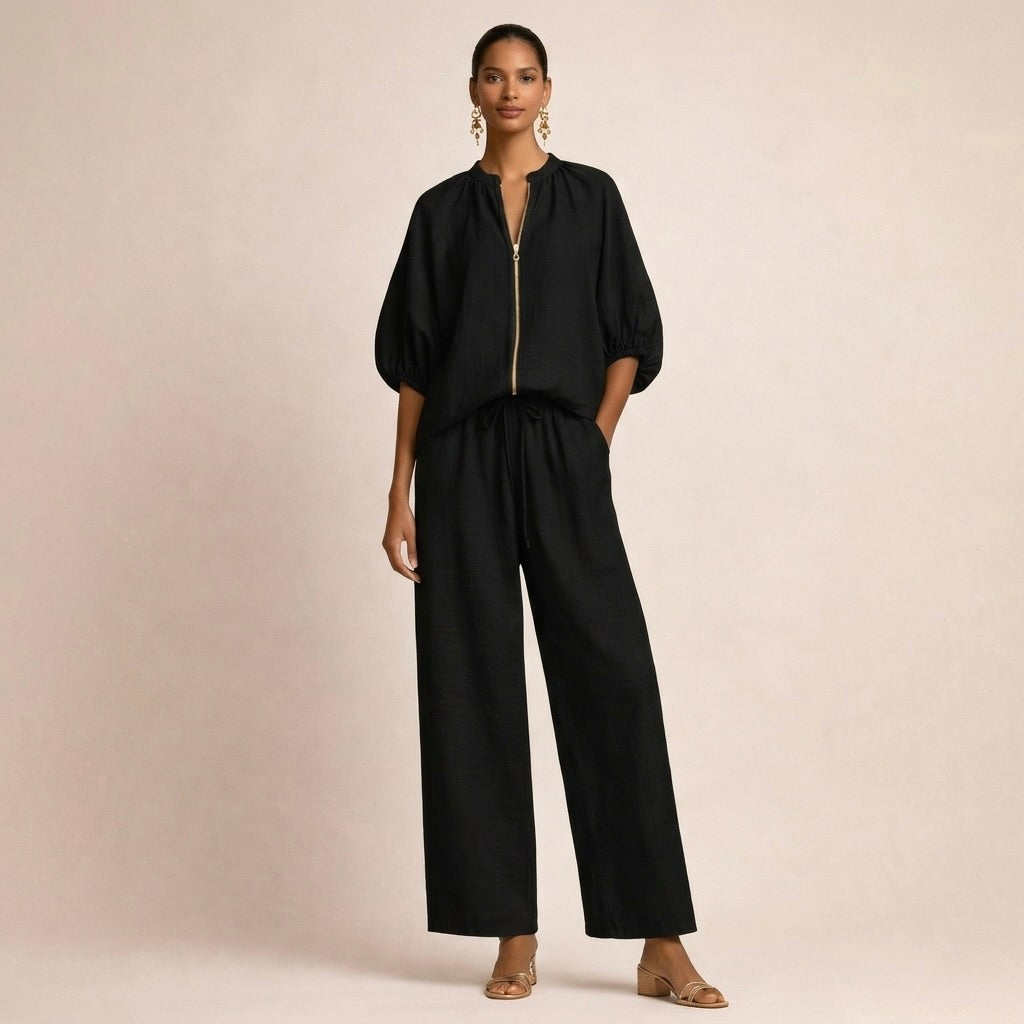 Close-up detail of the front zipper and gathered neckline of the Briar comfortable set in black.