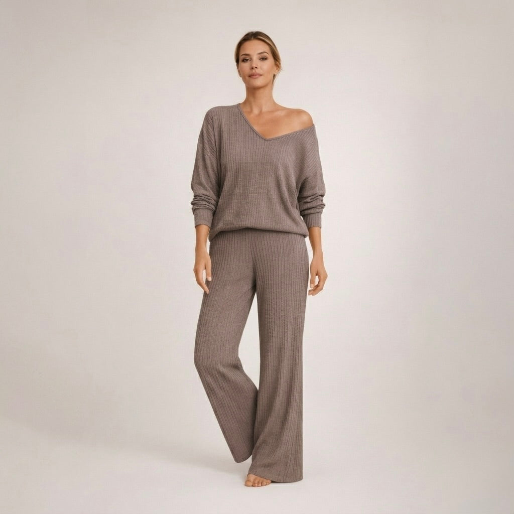 Close-up detail of the soft ribbed knit fabric on the V-neck top of the cozy loungewear set, highlighting the texture and stitching.