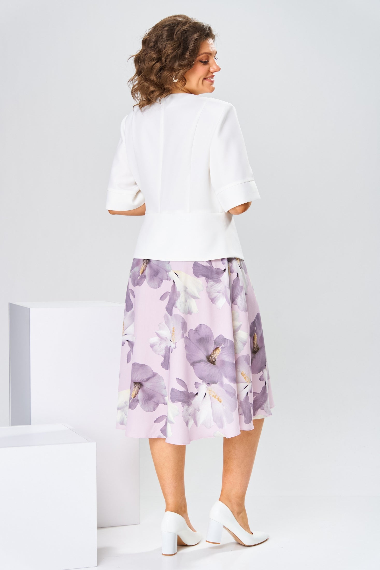 Another lifestyle image showing the versatility of the Celeste cotton-silk dress for various elegant occasions.