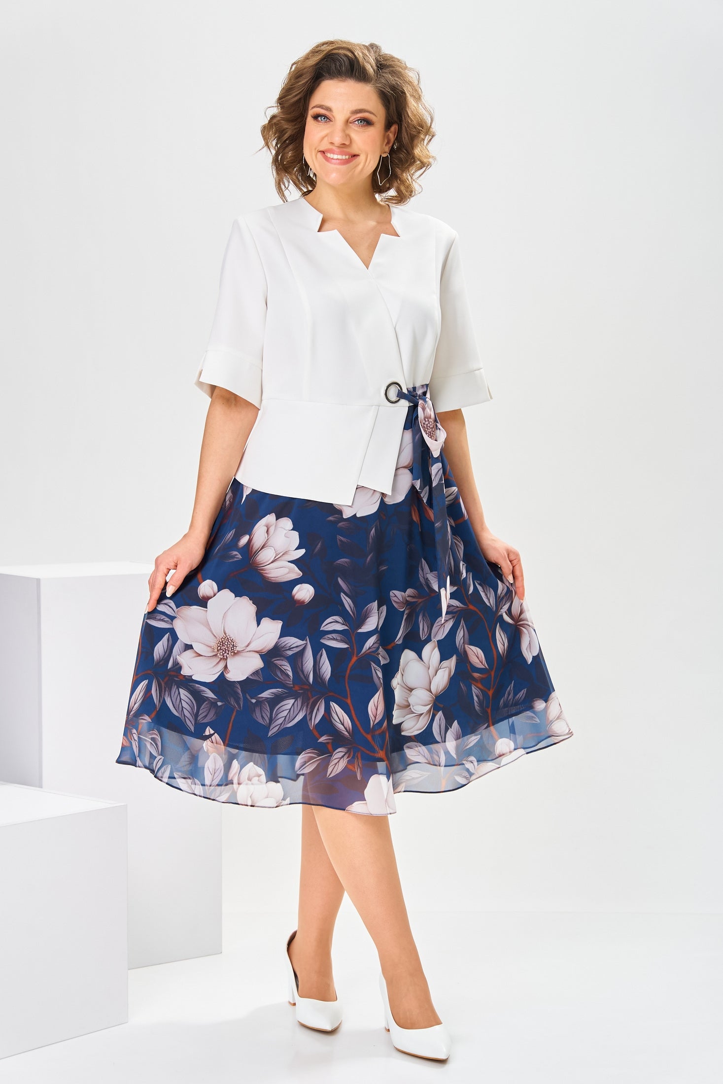 Side profile of a model wearing the Celeste cotton-silk dress, highlighting the graceful movement of the fabric.