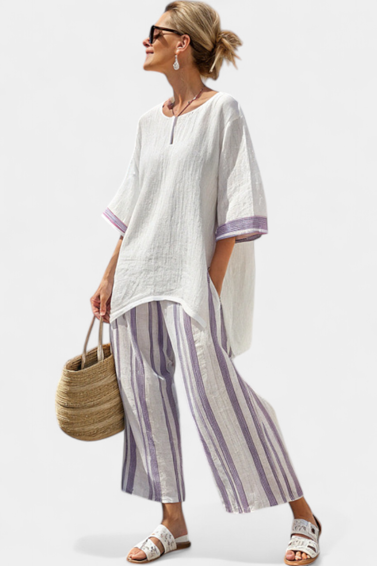 Back view of the women's relaxed blouse and wide-leg trousers set, emphasizing the elegant drape and casual style.