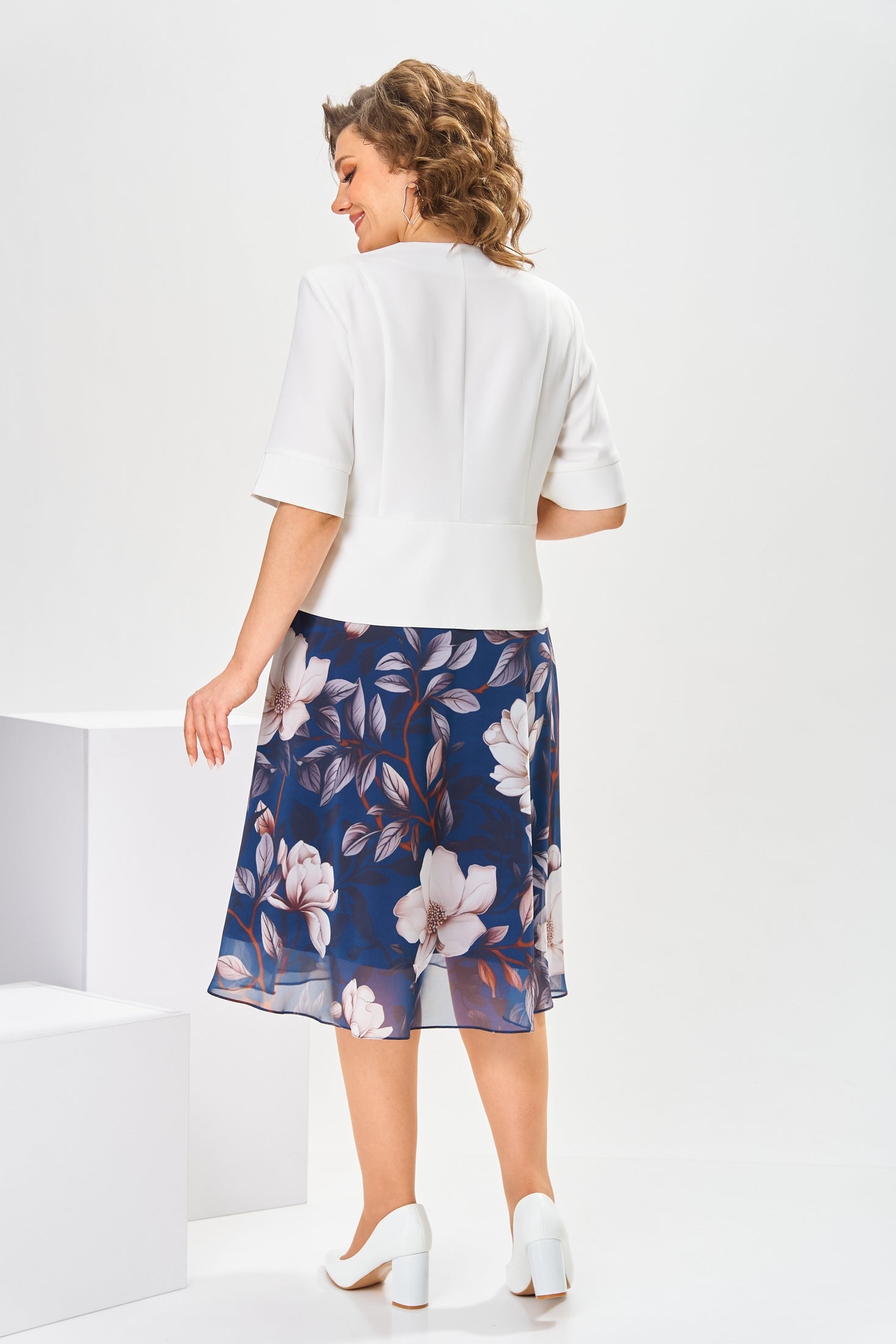 Lifestyle shot of someone enjoying a sunny day while wearing the light and airy Celeste cotton-silk dress.