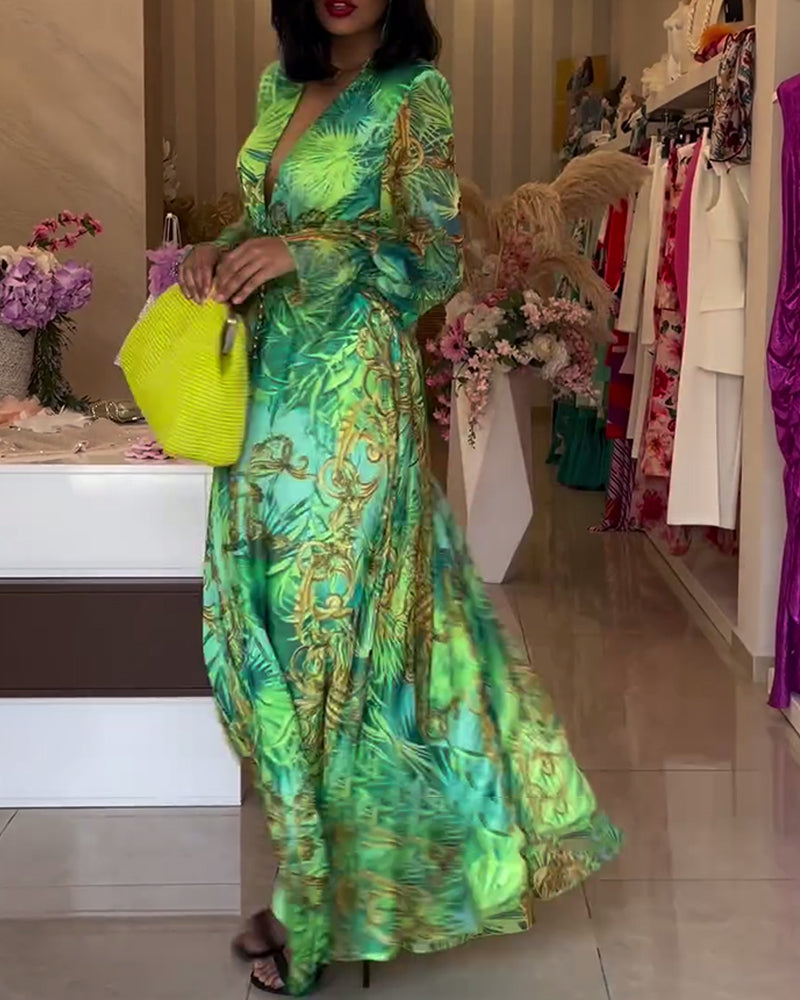 Detailed shot of the elegant side split on the green maxi dress, adding a touch of allure.