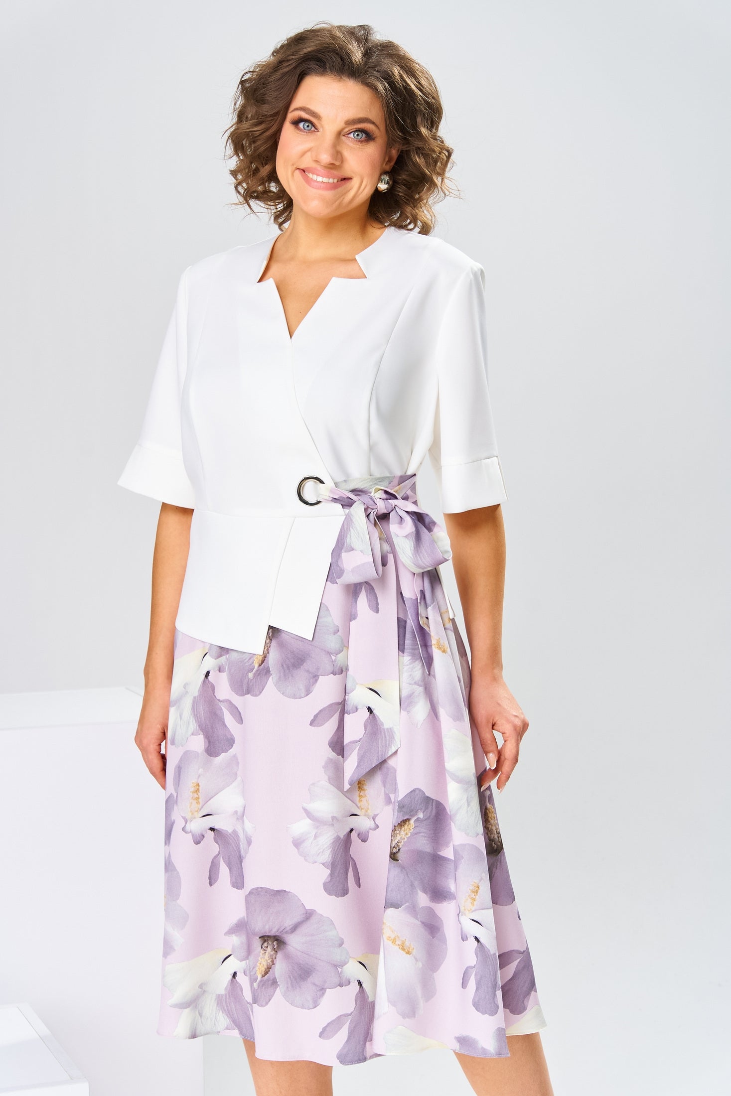 Model gracefully walking in the Celeste cotton-silk dress, illustrating its fluid silhouette and comfort.