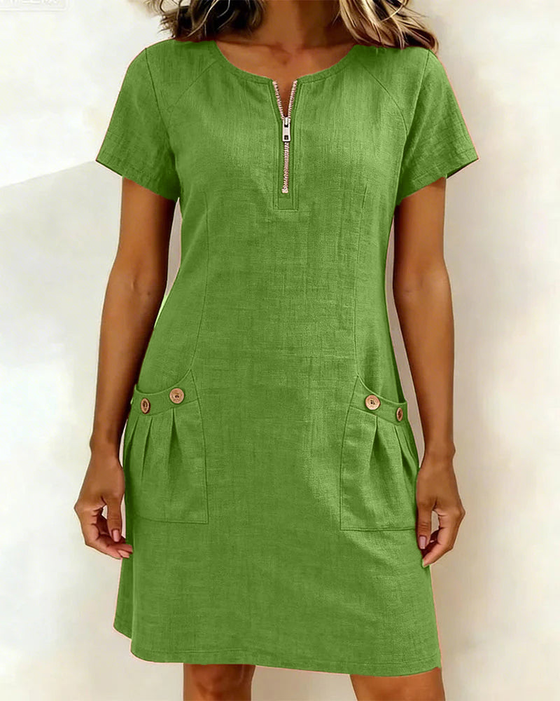 Flat lay of the Clara short dress in blue, displaying its minimalist design.