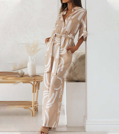 Back view of the elegant abstract jumpsuit, showcasing its drape and unique design.