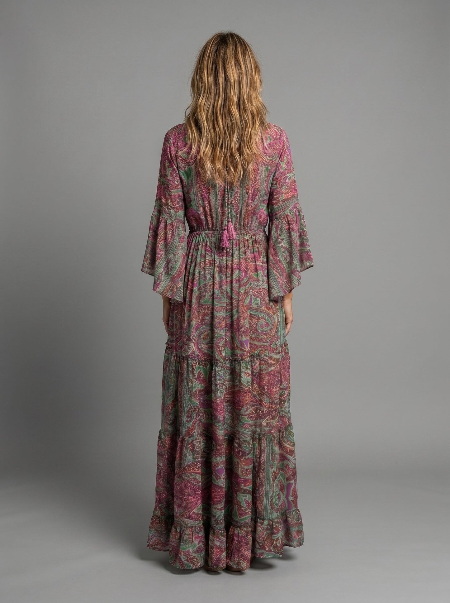 Woman walking in the versatile blue floral maxi dress, demonstrating its ease of wear.