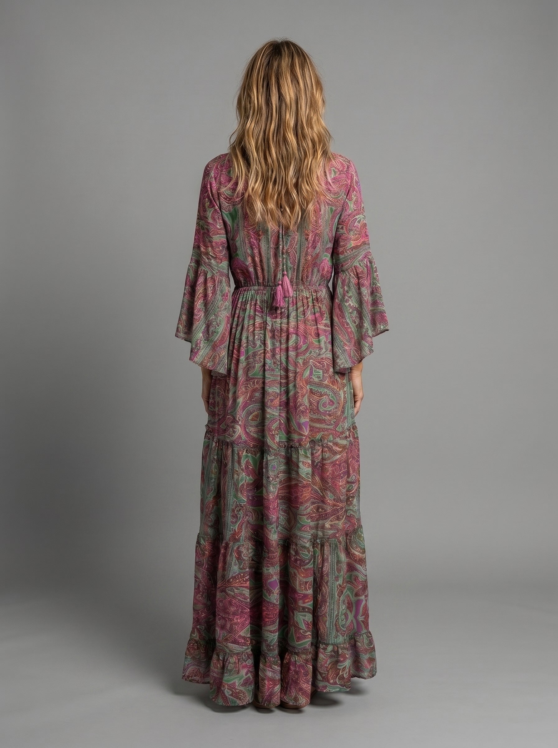 Woman walking in the versatile blue floral maxi dress, demonstrating its ease of wear.