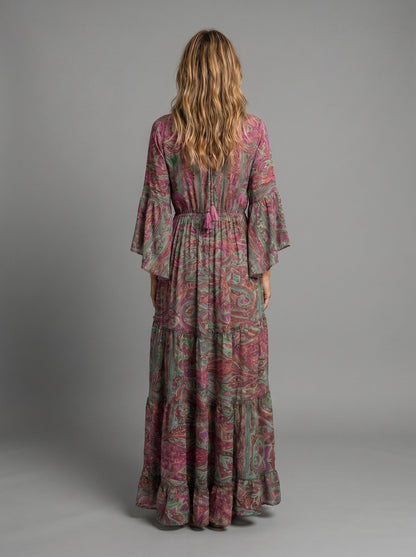 Woman walking in the versatile blue floral maxi dress, demonstrating its ease of wear.