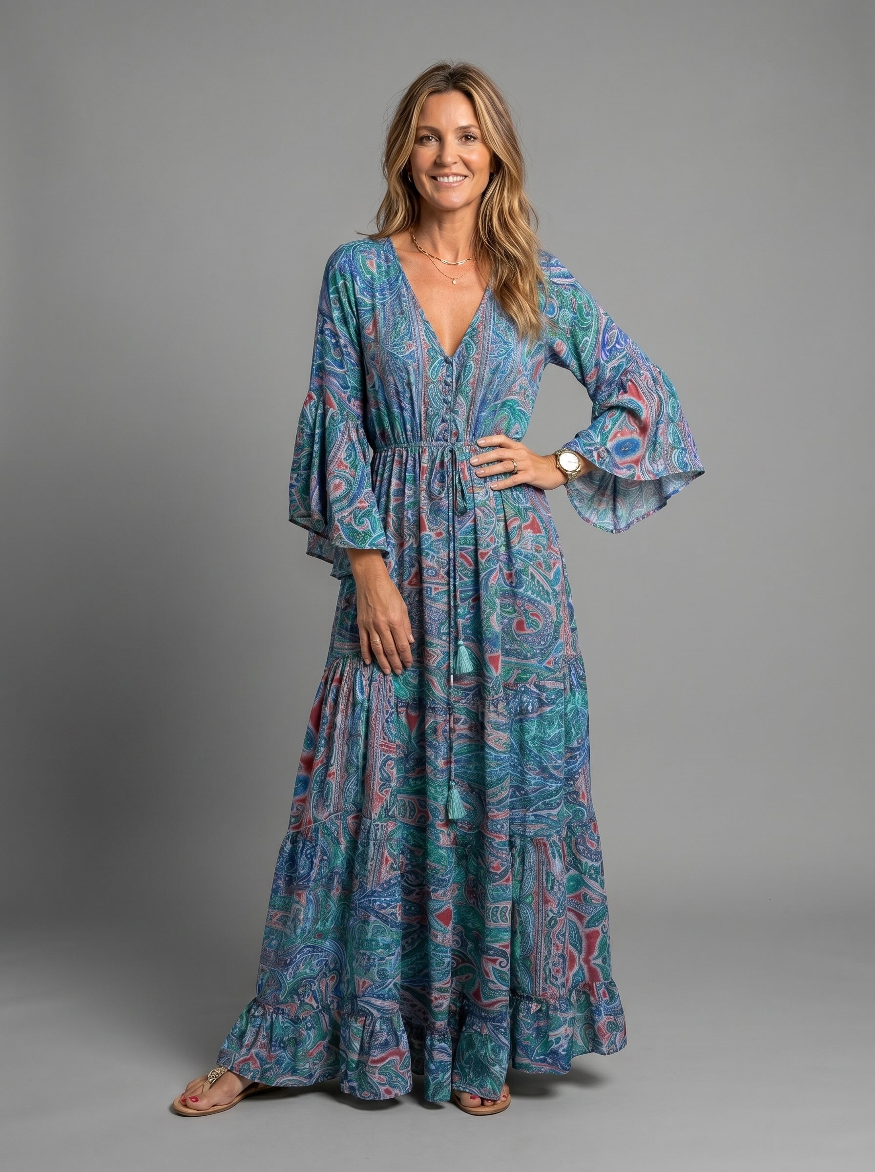 Full-length view of the blue floral maxi dress on a model, highlighting its flattering silhouette.