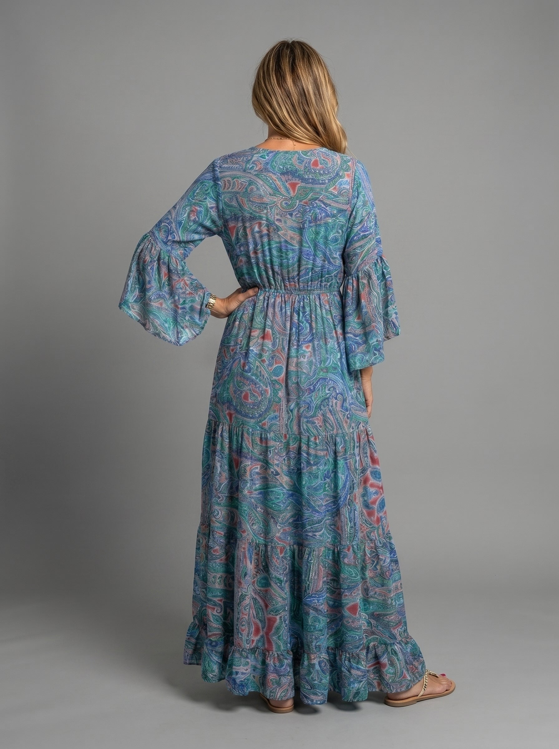 Styled shot of the blue floral maxi dress paired with accessories, perfect for summer events.