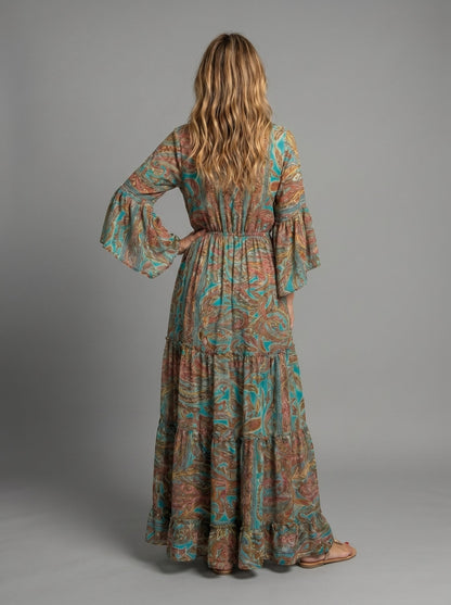 Side profile of the blue floral maxi dress, highlighting the flowing fabric and lantern sleeves.