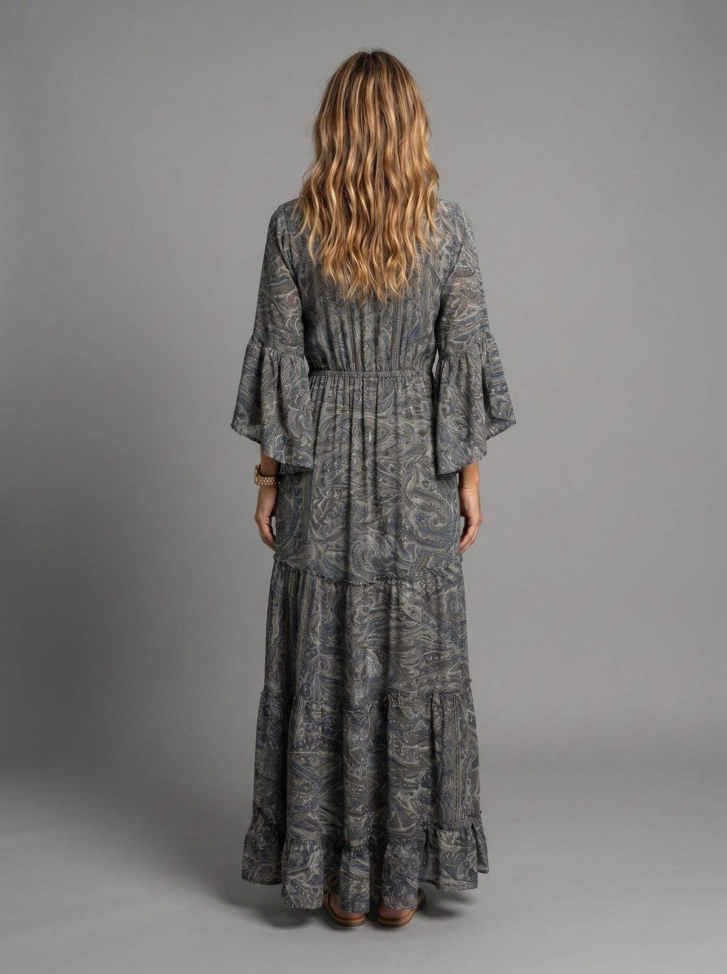 Back view of the bohemian-inspired maxi dress, showing the elegant drape and full length.