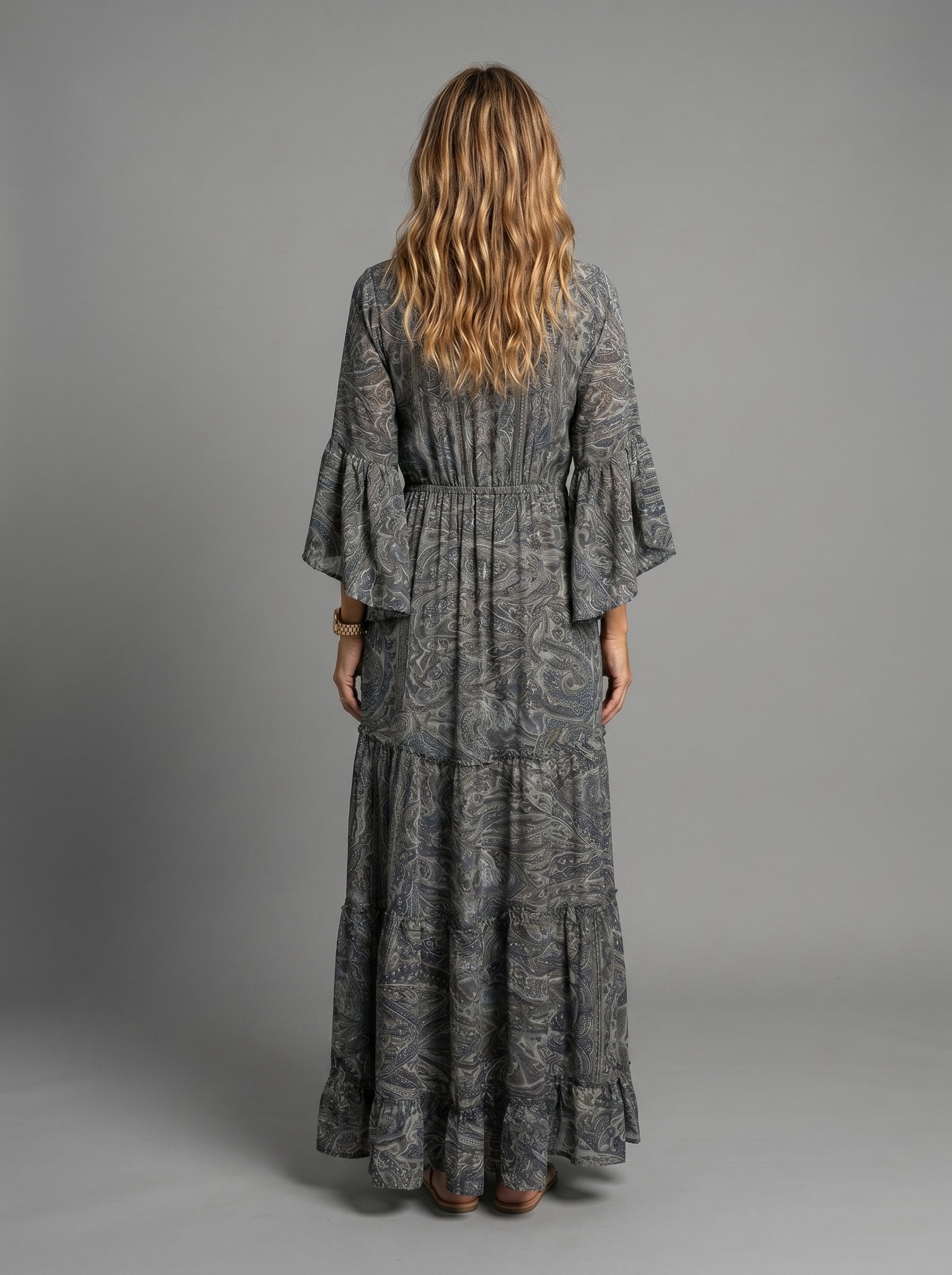 Back view of the bohemian-inspired maxi dress, showing the elegant drape and full length.