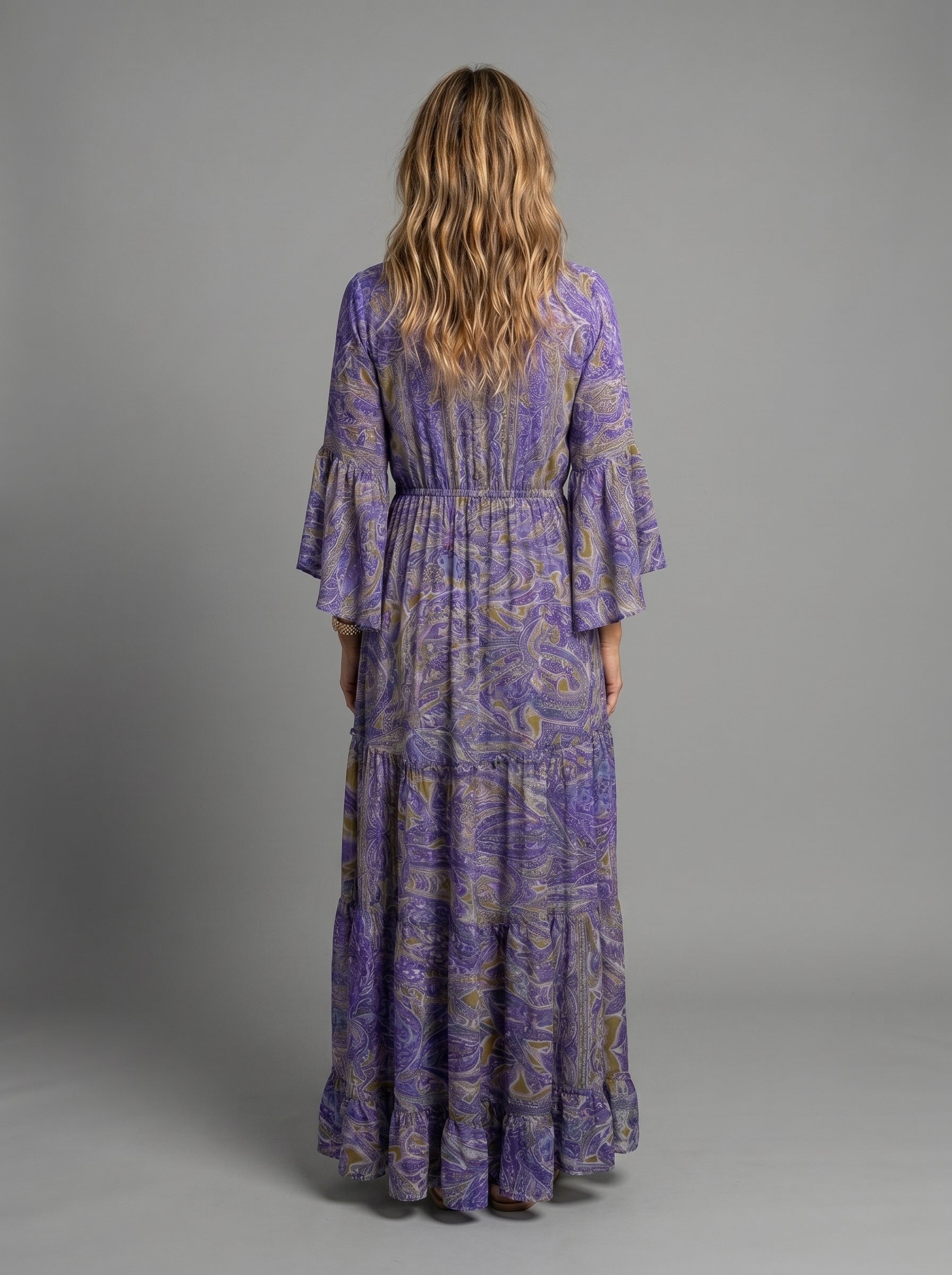 Detail shot of the V-neckline and soft lantern sleeves of the comfortable maxi dress.