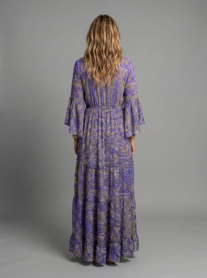 Detail shot of the V-neckline and soft lantern sleeves of the comfortable maxi dress.