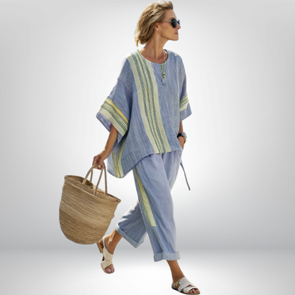 A flat lay arrangement of the two pieces of the Paloma relaxed boho set in purple, highlighting the full outfit.