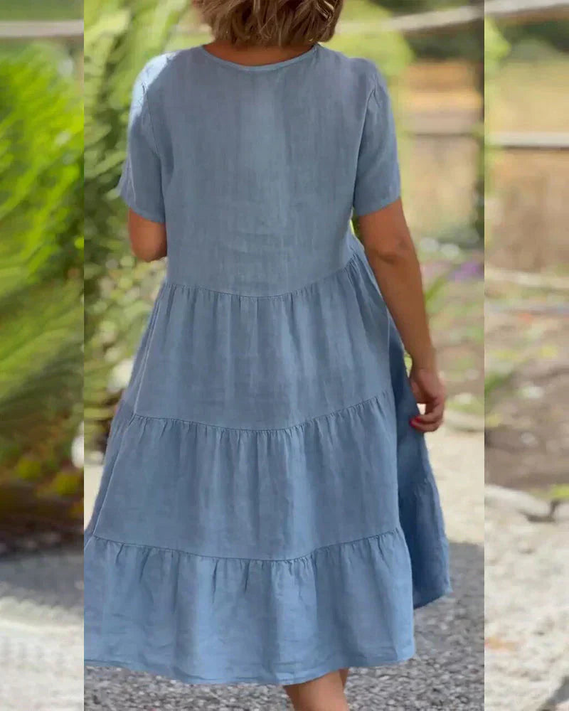 Close-up of the V-neck and collar area of the Esmée flowy boho midi dress, showing the delicate finishing.