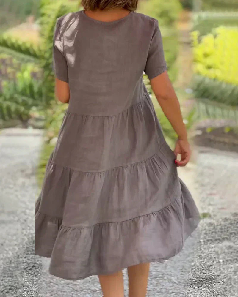 Detail shot of the short sleeve and side seam of the Esmée flowy boho midi dress, indicating quality craftsmanship.