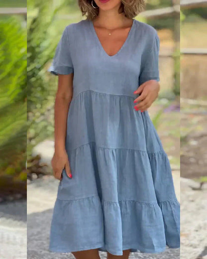 A model sitting casually in the Esmée flowy boho midi dress, demonstrating its comfort and versatility for relaxed moments.