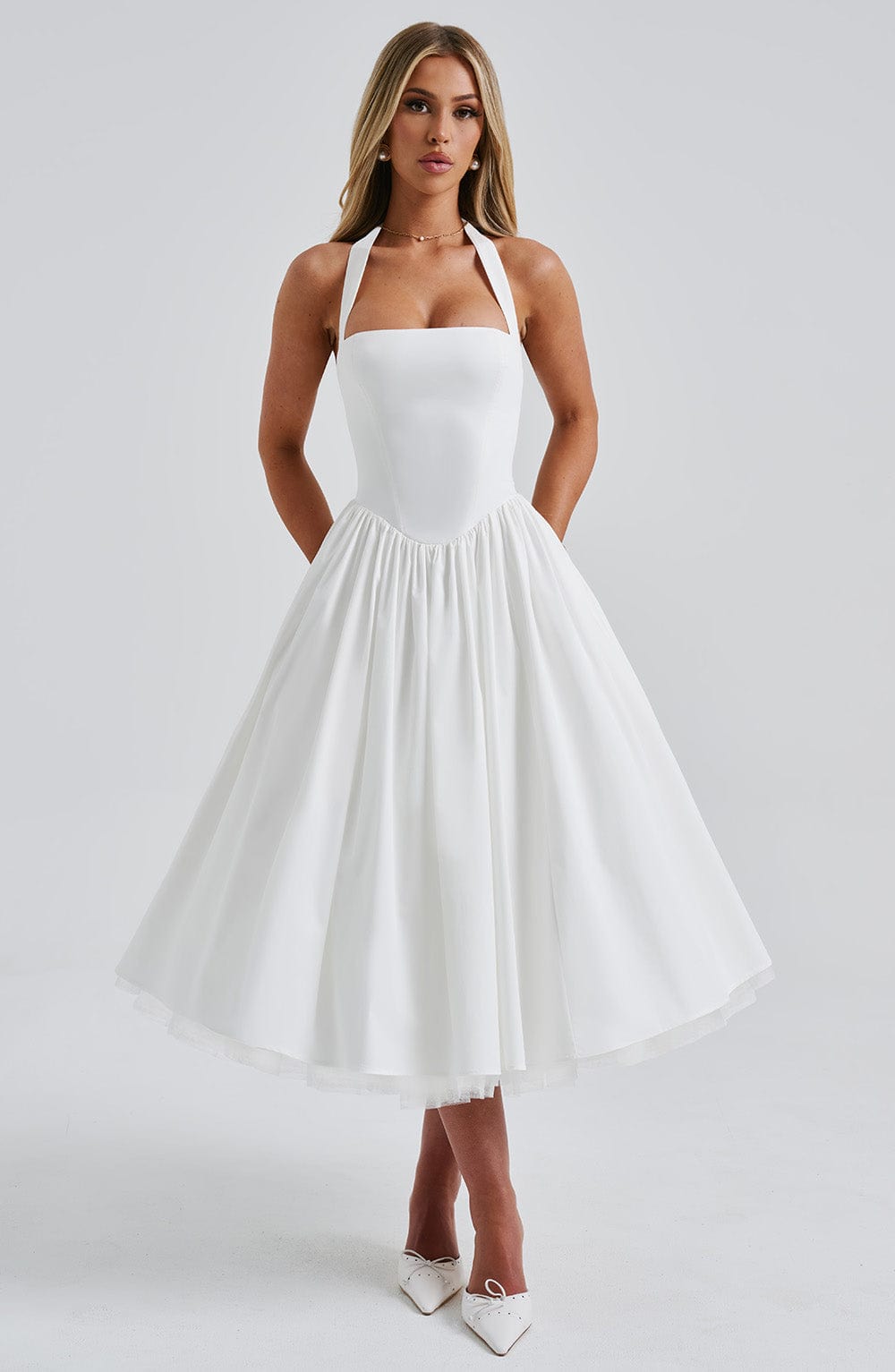 Close-up detail of the unique square halter neckline of the Evanthe midi dress on a mannequin.