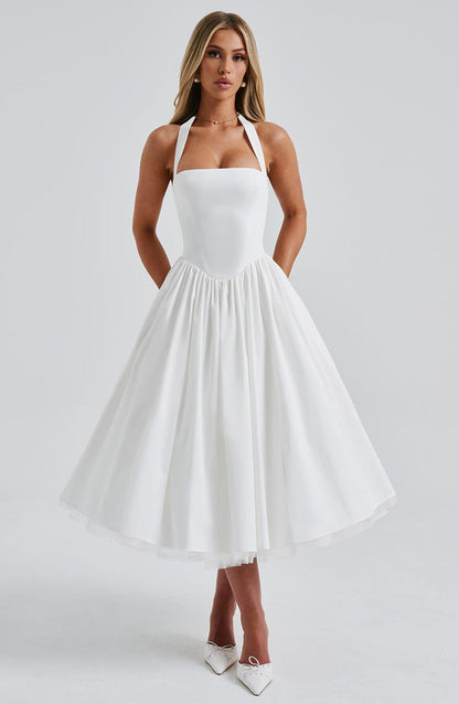 Close-up detail of the unique square halter neckline of the Evanthe midi dress on a mannequin.