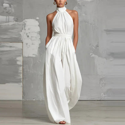 Front view of the Evie black wide-leg summer jumpsuit showcasing its elegant halter neckline.